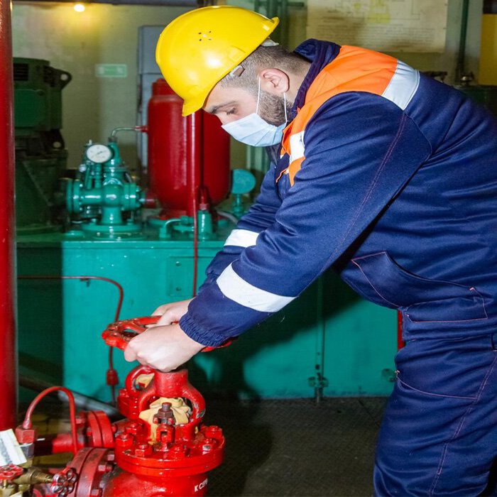 Fire extinguisher refilling and servicing by certified technician.