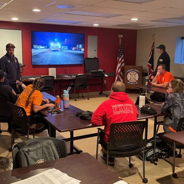 Fire safety team at event briefing with managers and staff.