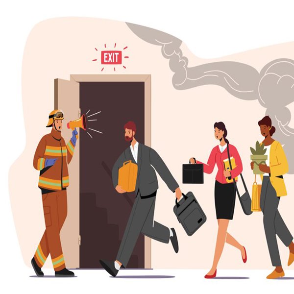 Fire drill debrief with management reviewing evacuation timings and action items.