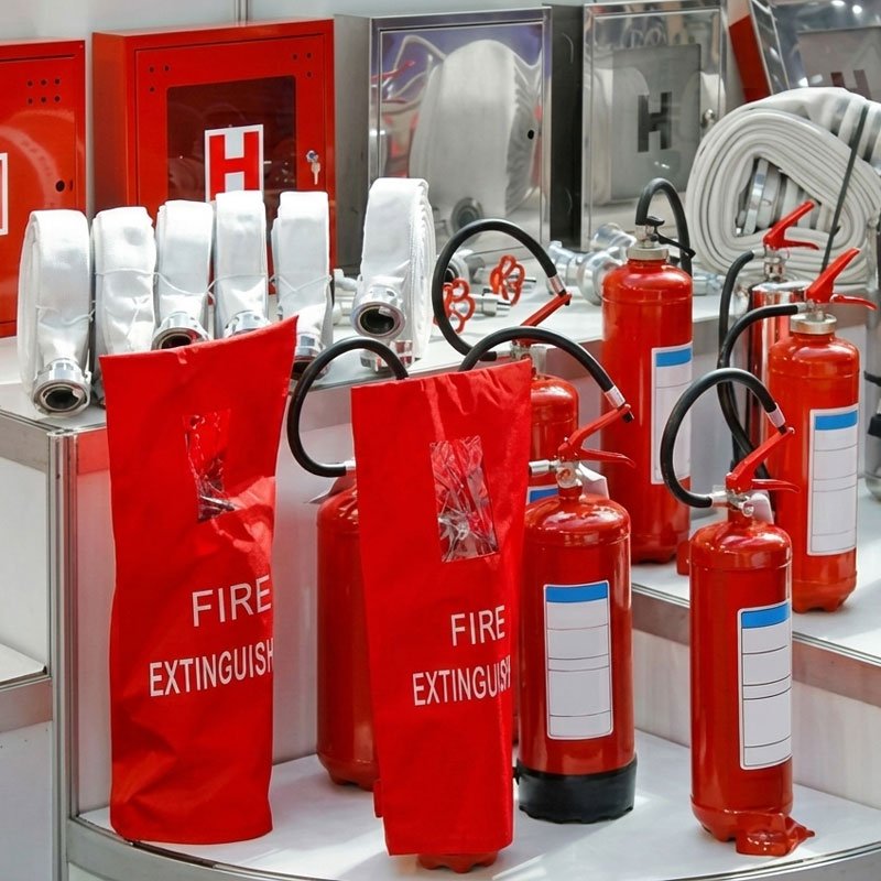 Fire safety equipment supplier team and warehouse showing quality stock.